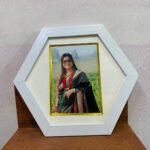 white 5x7 round frame with photo
